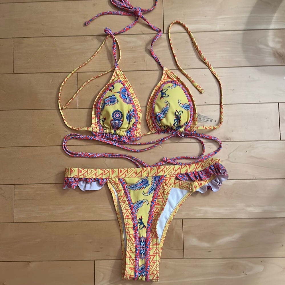 Bran new bikini, white red and blue print has a wraparound string for your waist